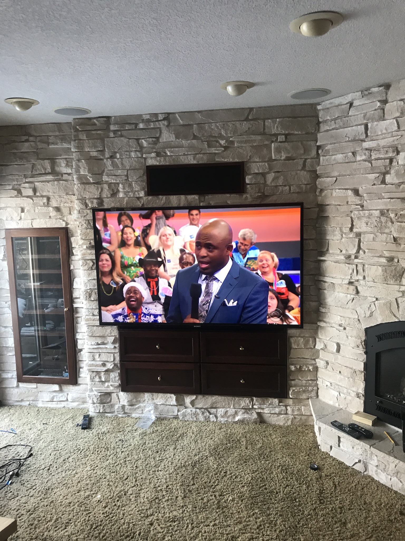 TV mounted in a stylish living room setup.