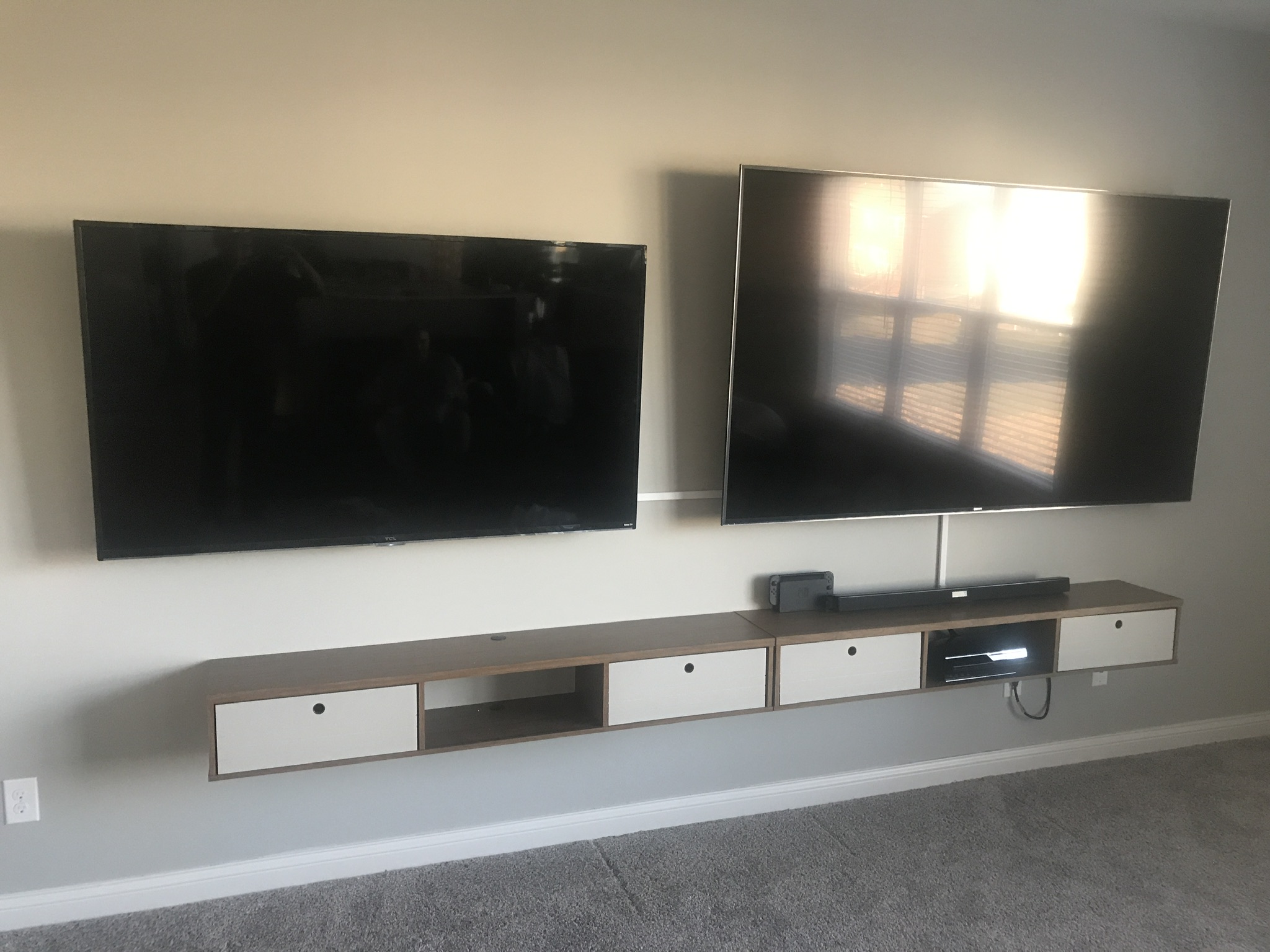 Large TV mounted on the living room wall.