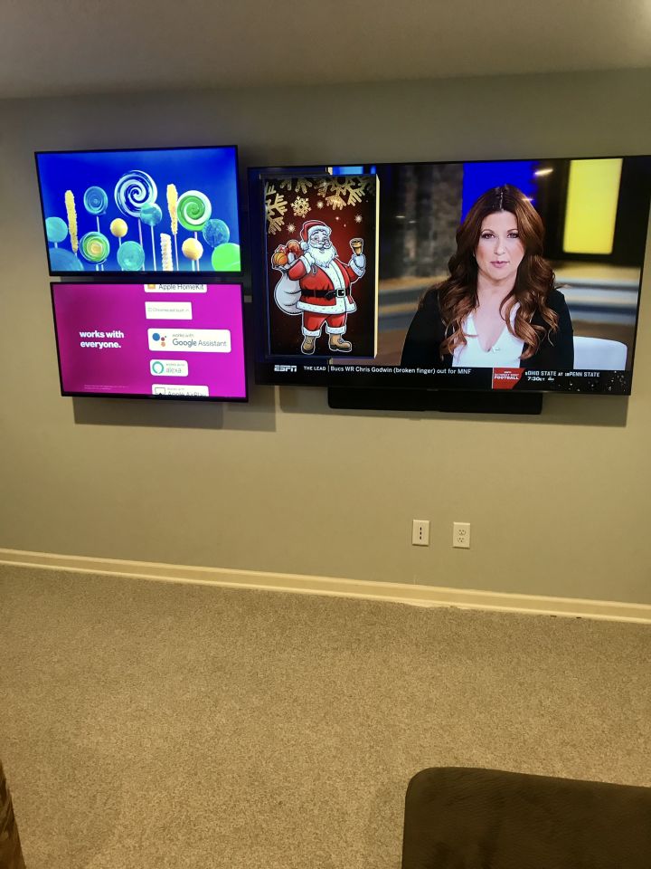 Wall mount holding a small flat-screen TV.