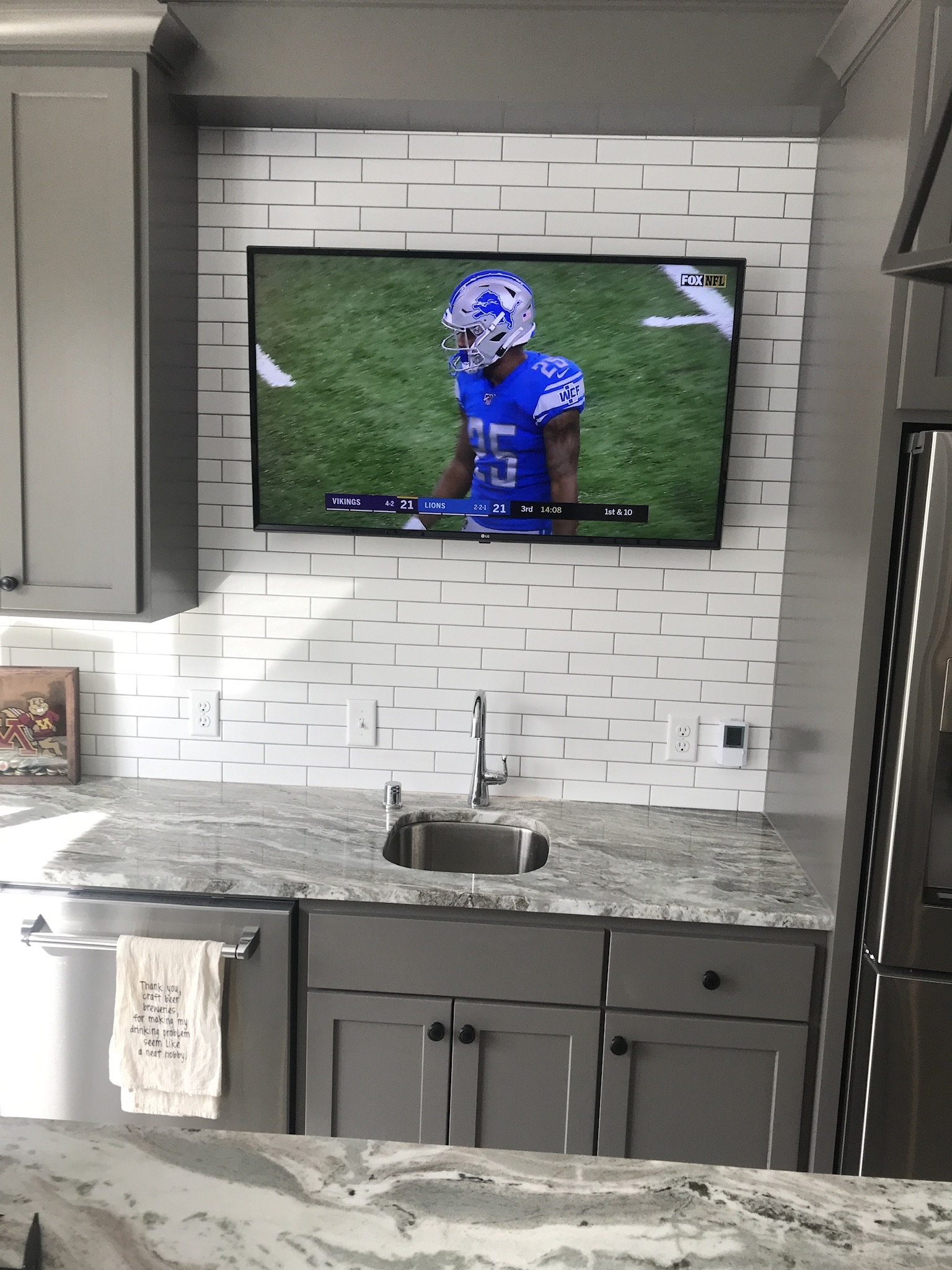 TV mounted with a tilt function for better viewing.
