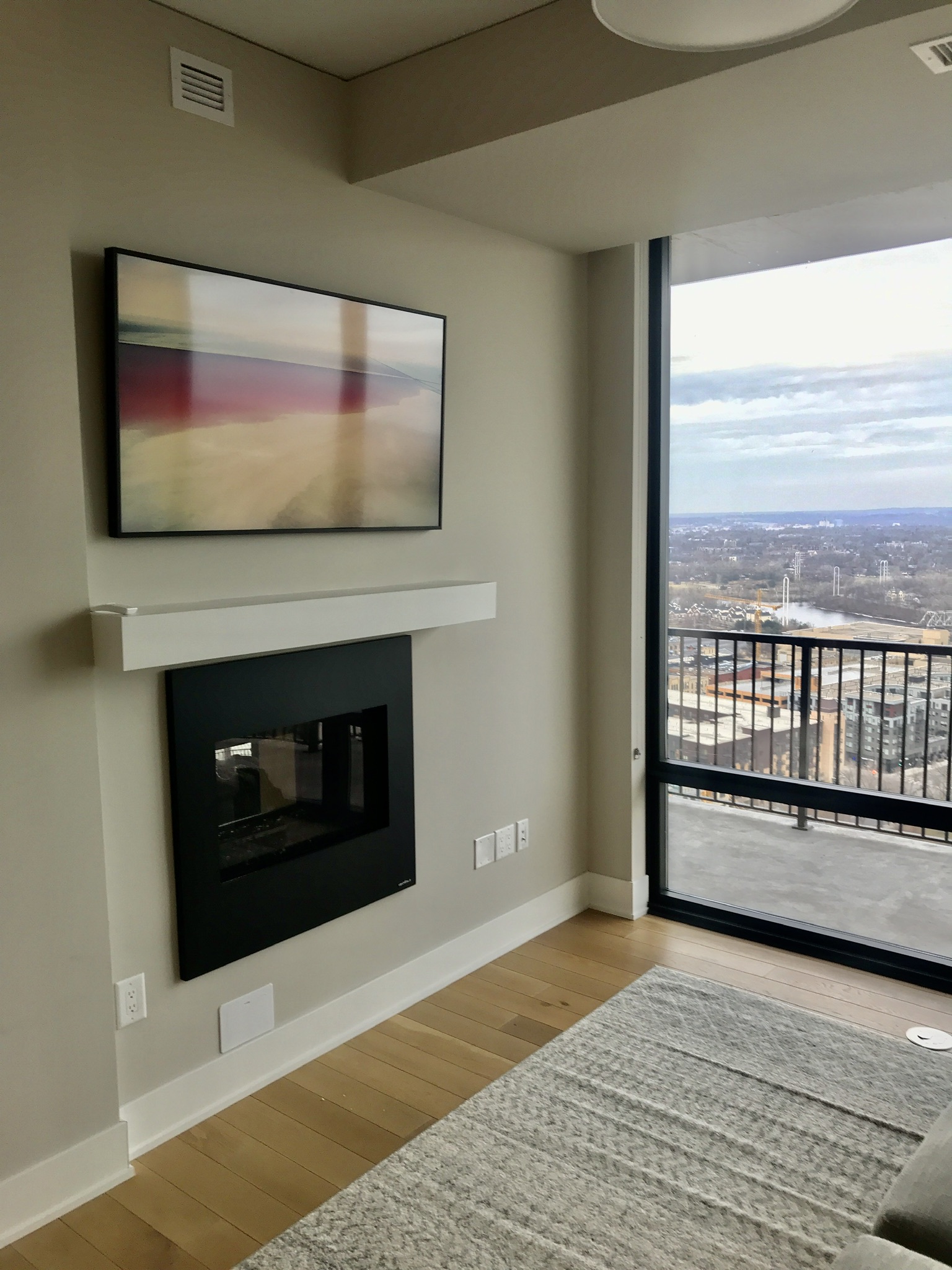 Wall-mounting a 50-inch flat screen TV.