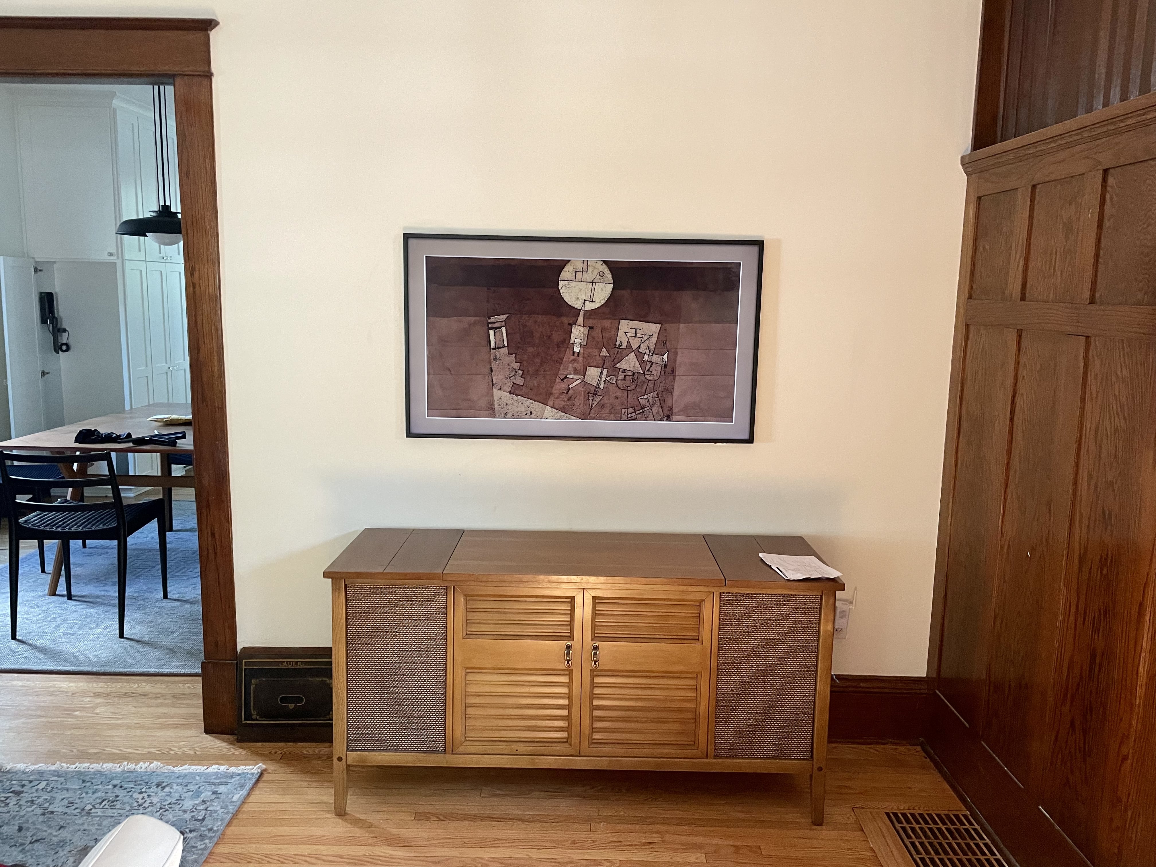 TV securely fixed to the wall with mount.