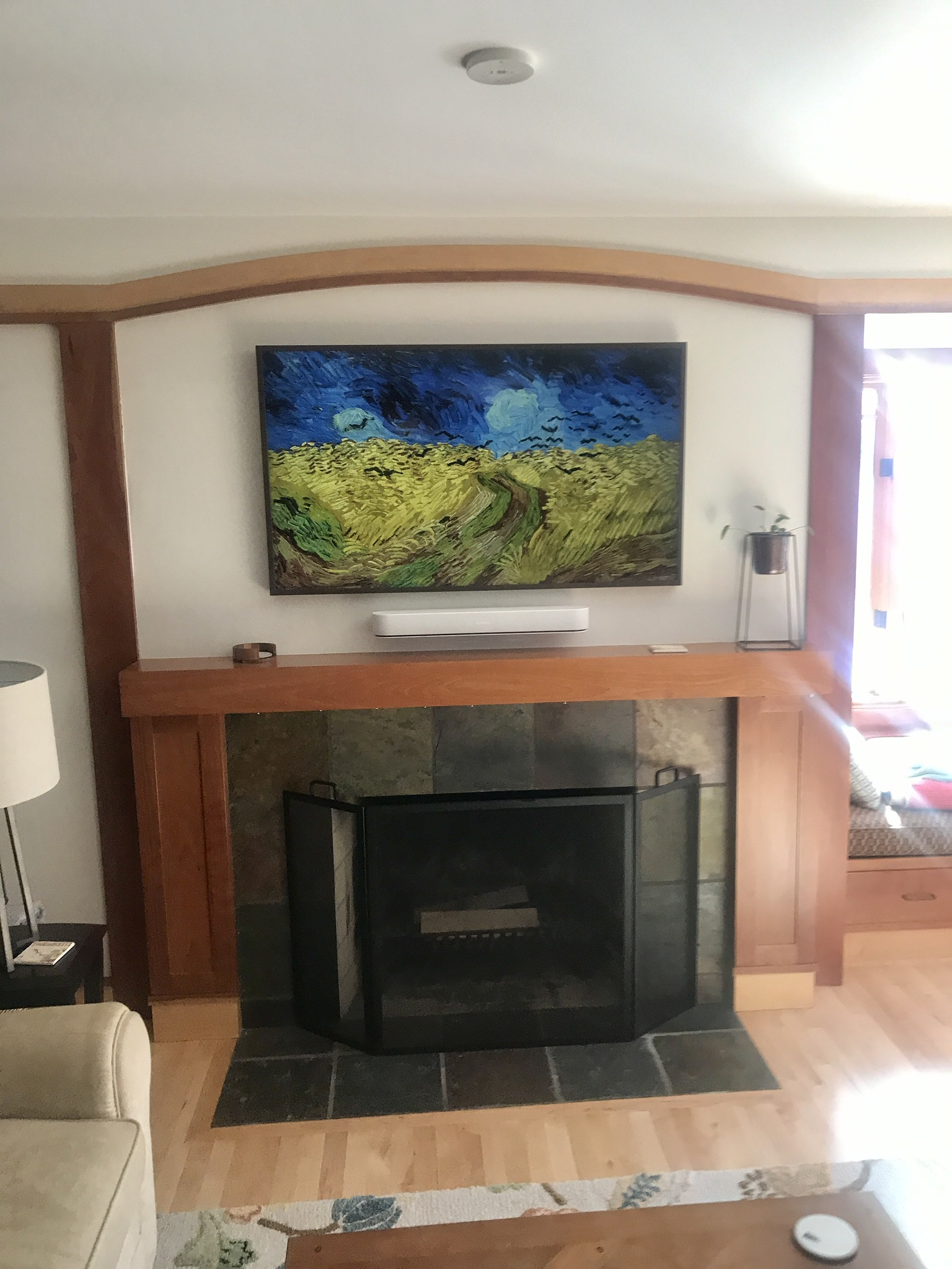 Flat-screen TV mounted in a corner.
