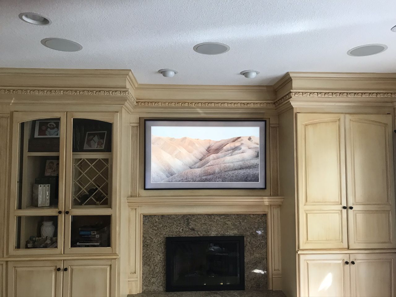 TV mounted above a stylish TV console