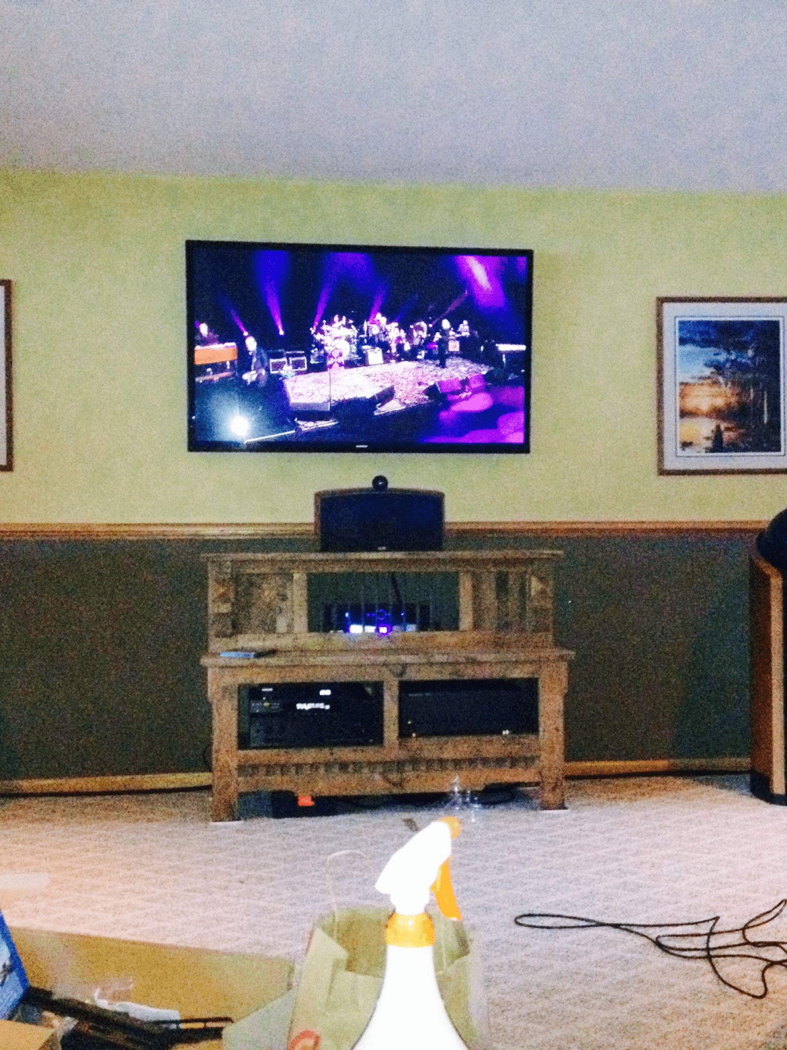 Mounted TV with easy-to-use tilt mechanism.